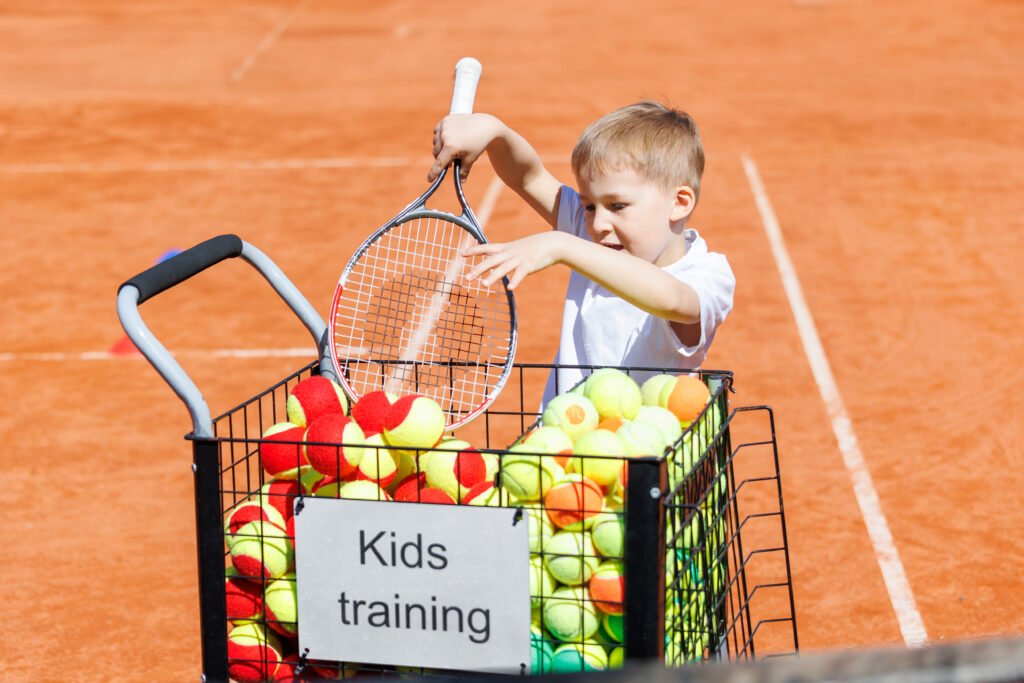 What Age Should You Start Playing Tennis? A Complete Beginner’s Guide Kids learning tennis at TopspinsG Tennis Academy with professional coaches