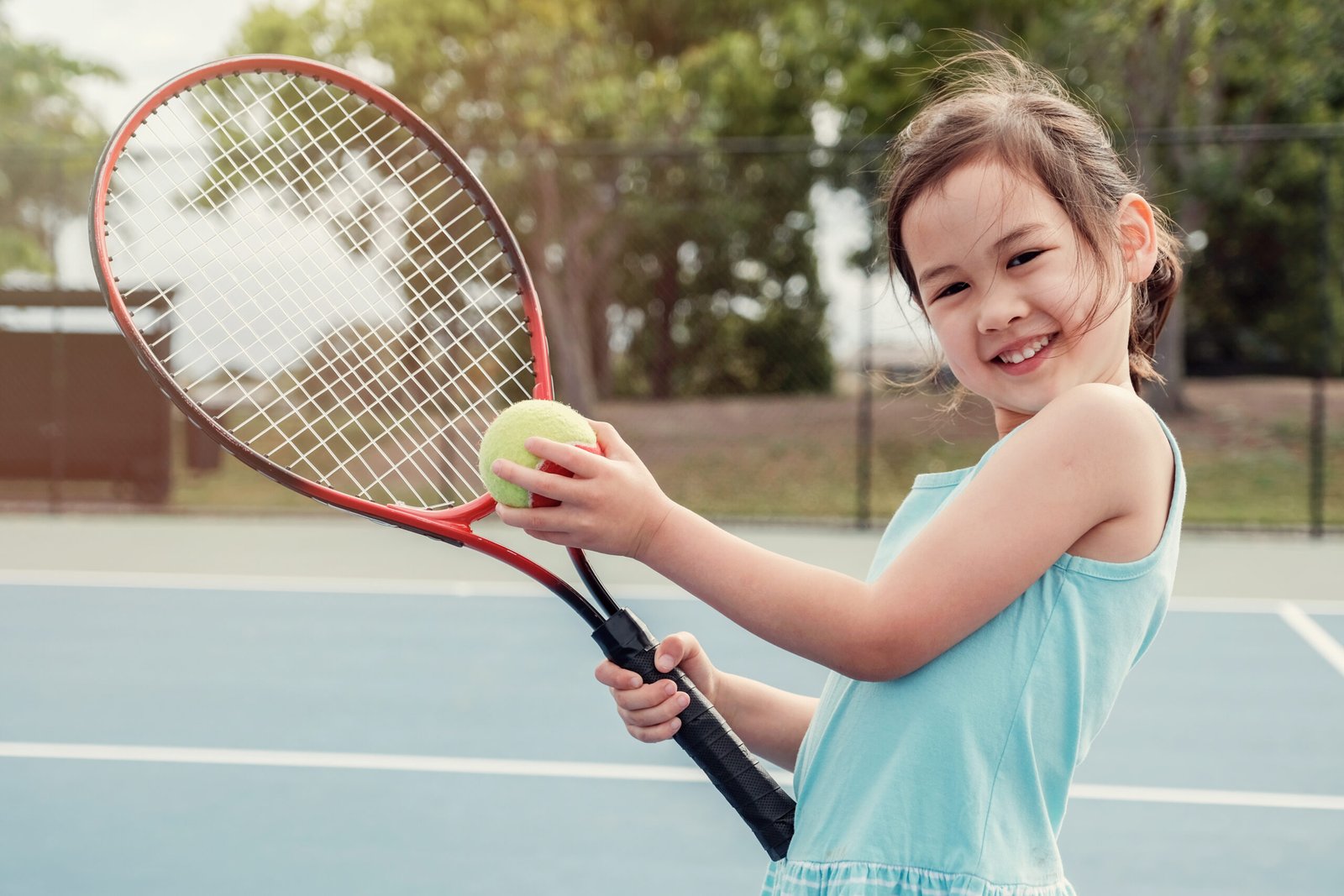 Young Asian Girl Tennis Player On Outdoor Blue Cou 2024 10 23 07 26 25 Utc Scaled